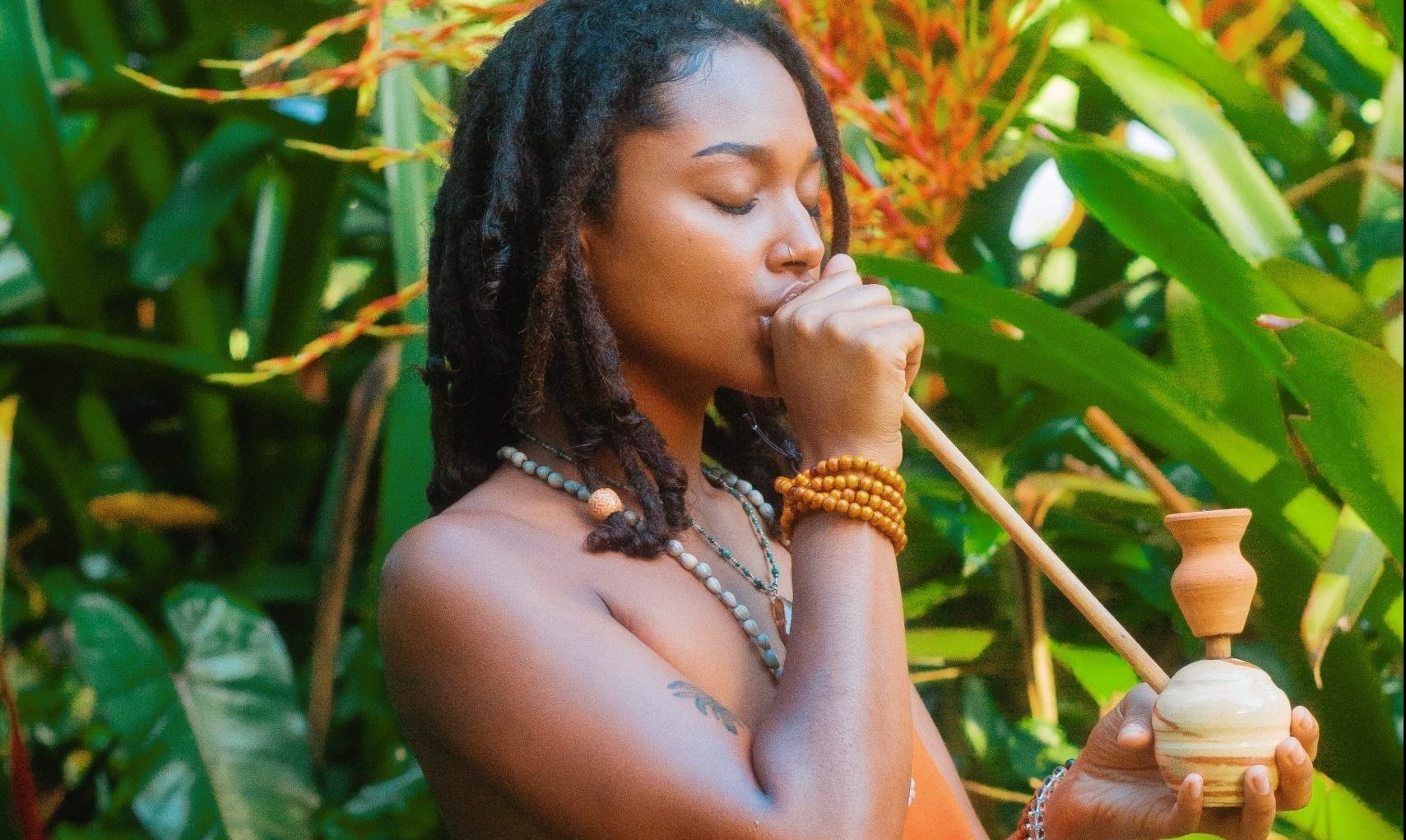 Adult using an authentic steam chalice in Jamaica