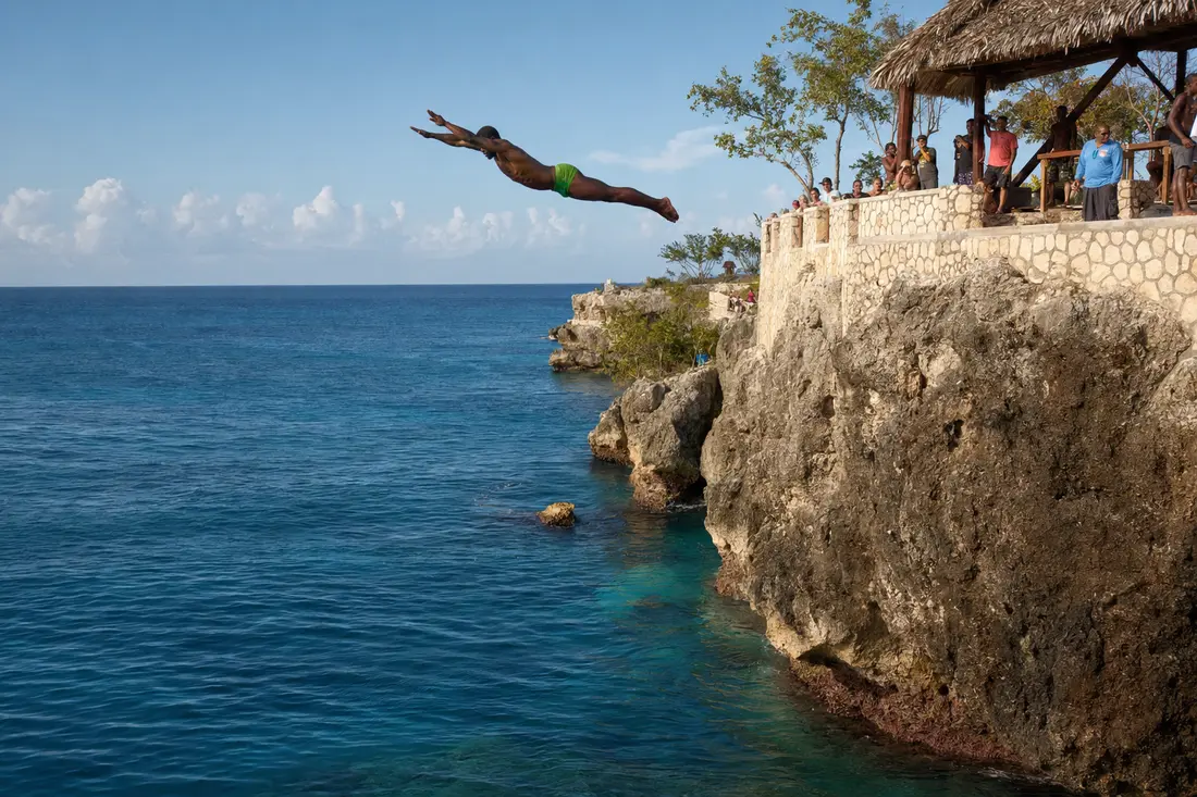 Cliff diver over the Caribbean on Negril's West End