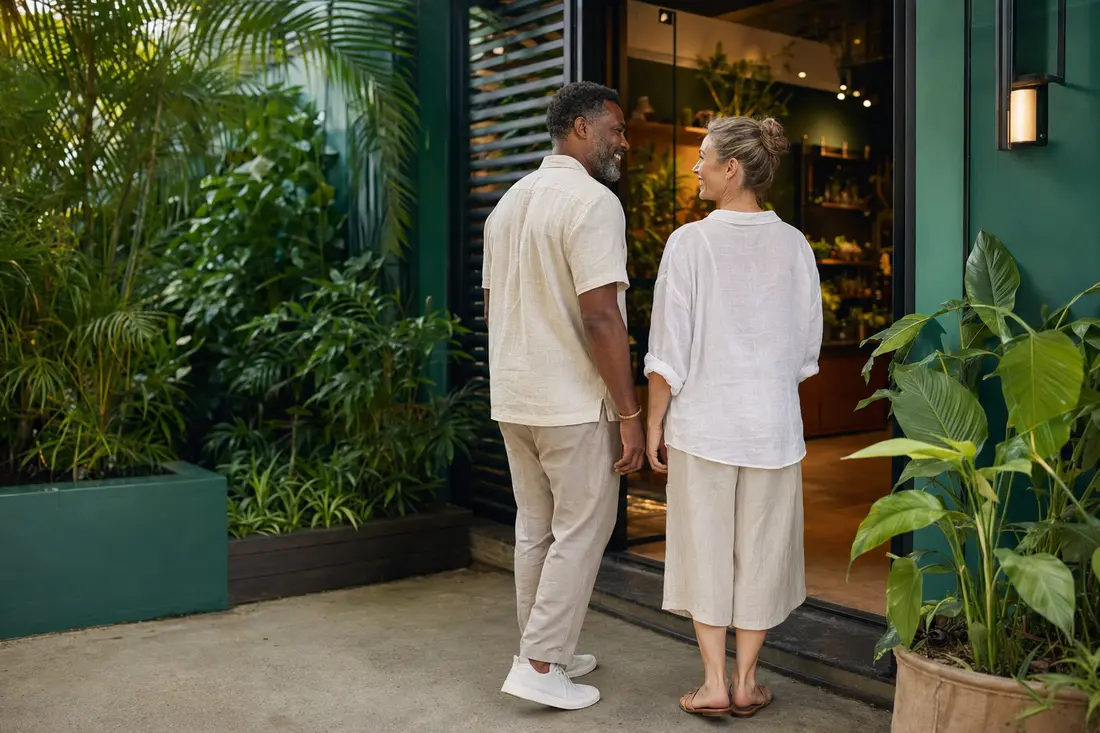 Tourists in breathable resort-casual clothing entering a licensed herb house